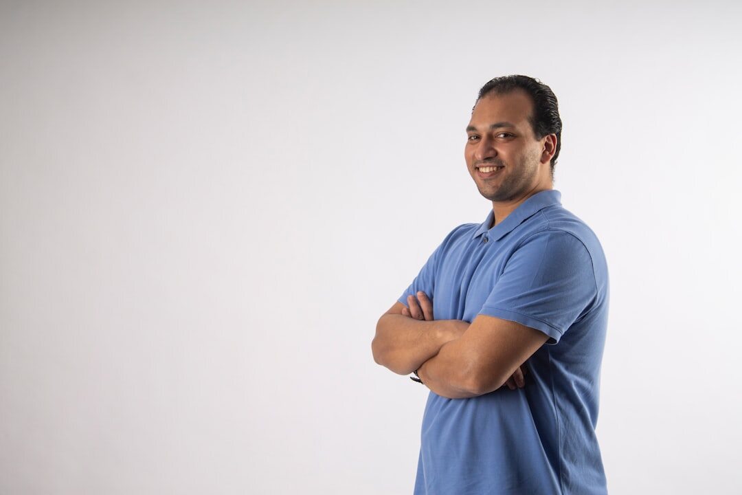 Studio portrait of a Latin American man in his 40s, logistics manager