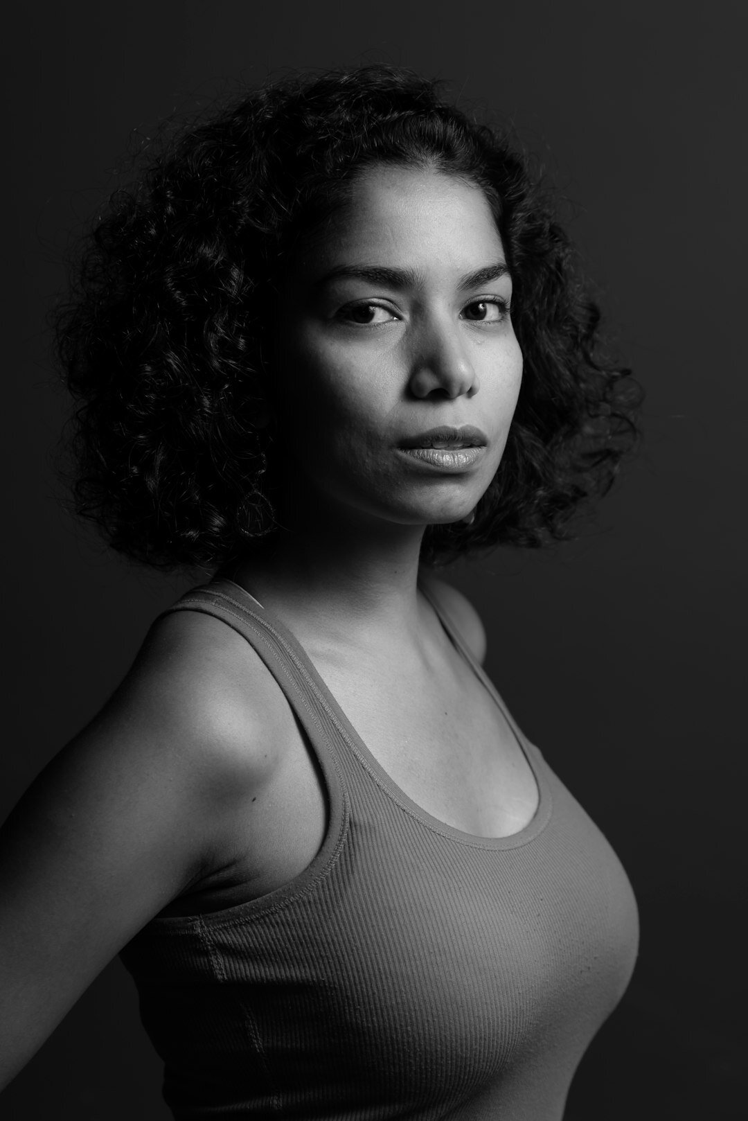 Studio portrait of a Black European woman in her 30s, outdoor activities coordinator
